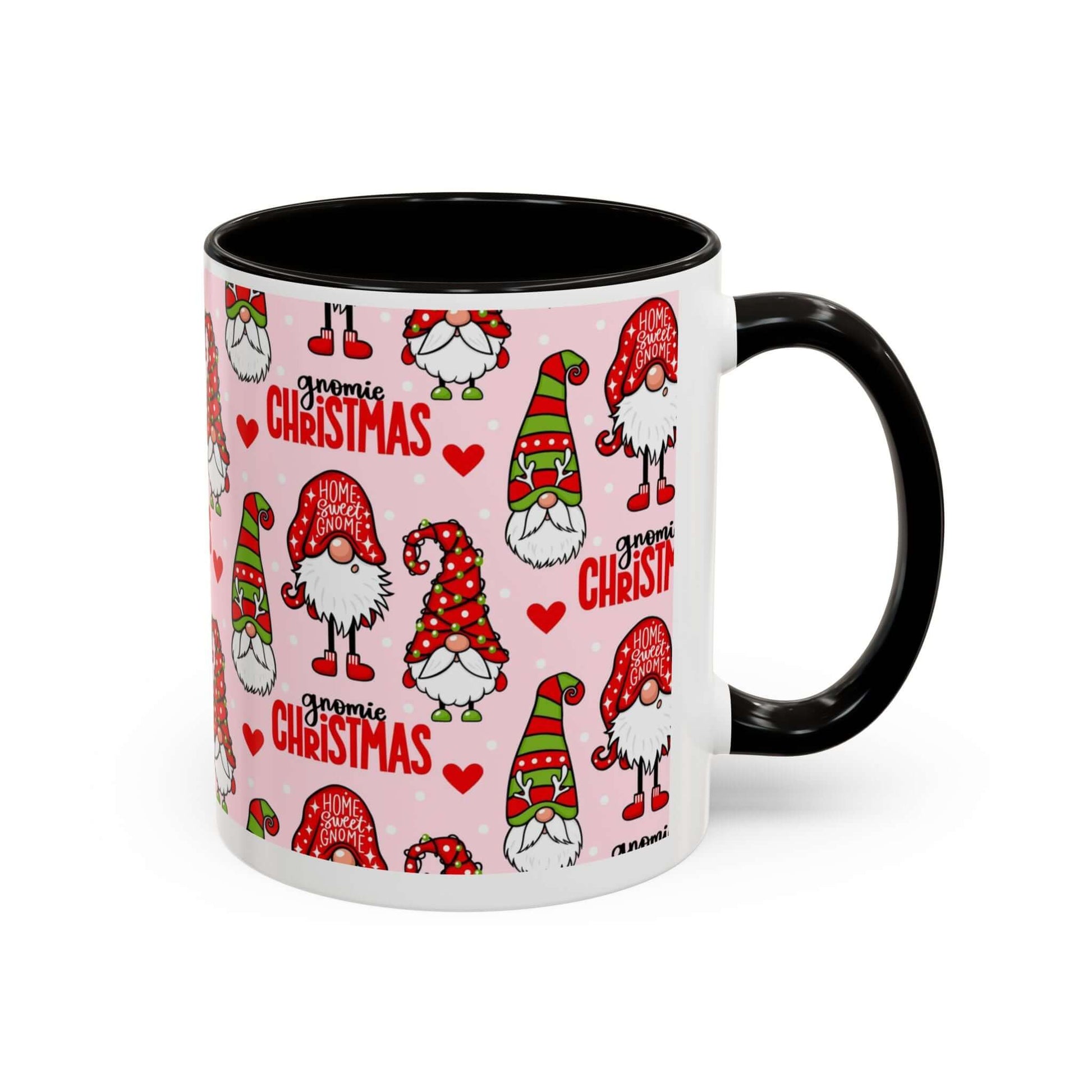 Festive Christmas gnome coffee mug with black handle on pink background, adorned with whimsical gnome designs.