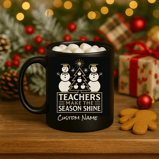 Customizable black mug featuring snowmen and the text 'Teachers Make the Season Shine' with holiday decorations.